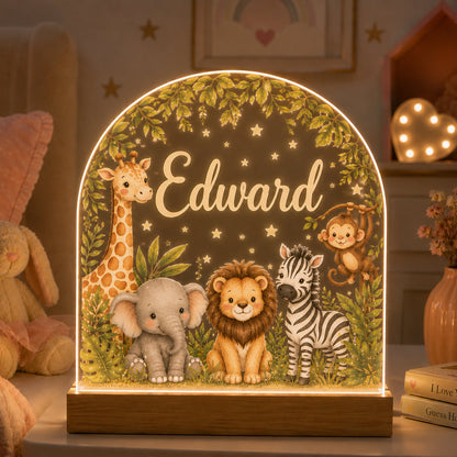 A personalized LED light table featuring safari animals including a giraffe, elephant, lion, zebra, and monkey under a leafy arch with the name 'Edward' in script, shown in a cozy child's bedroom setting.